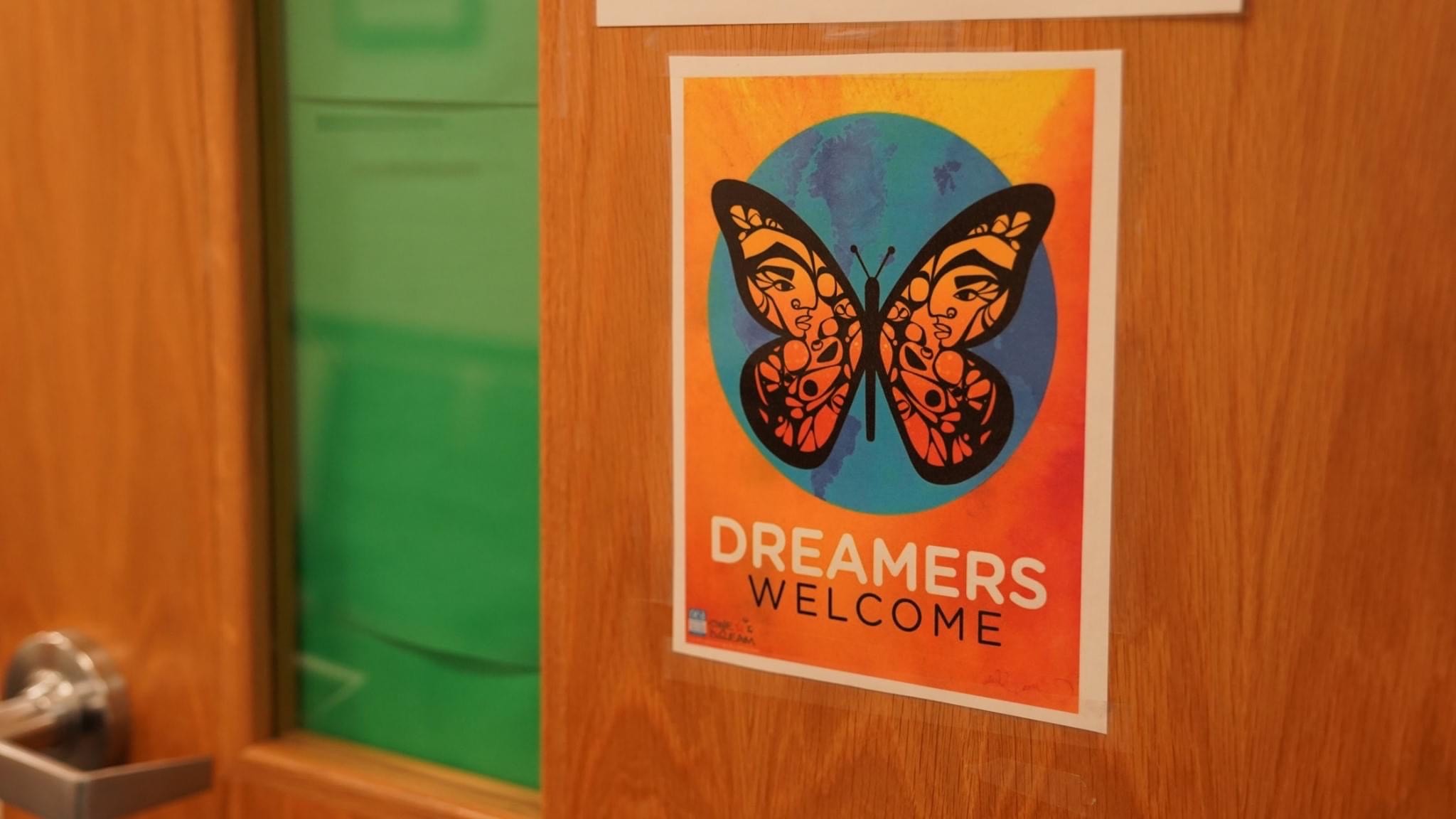 Door with a Dreamers Welcome poster